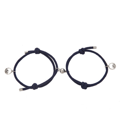 Two navy blue New Alloy Eachother Couple Bracelets with silver beads on a white background