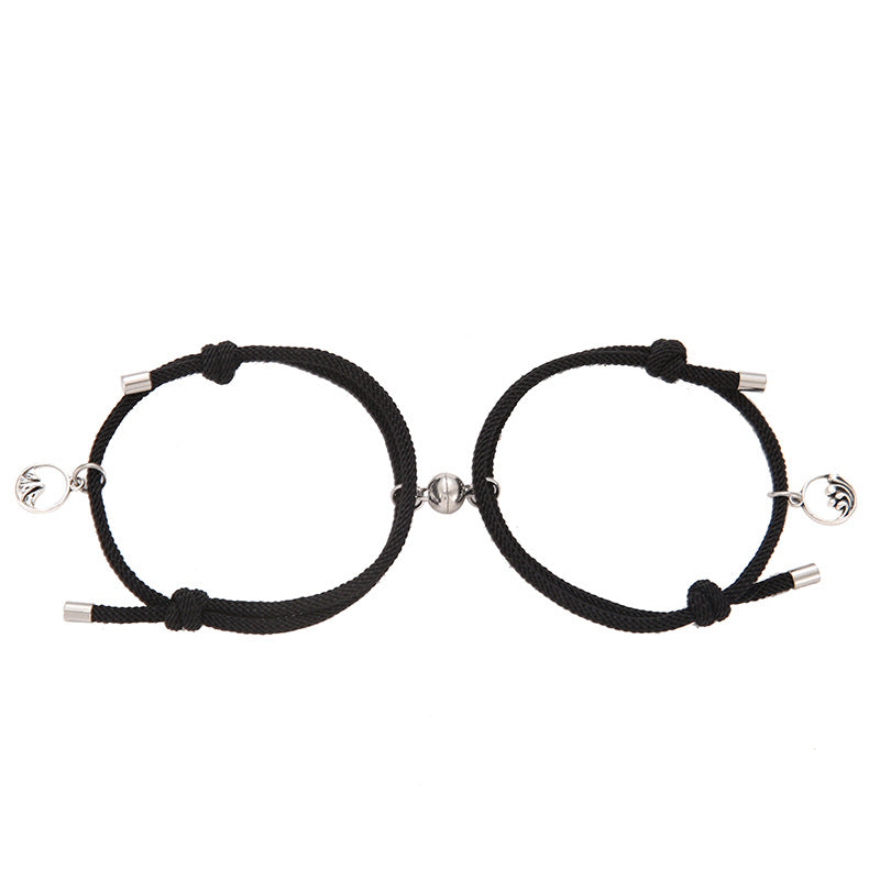 Two black New Alloy Eachother Couple Bracelet with silver beads on a white background