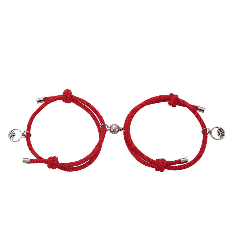 Two red bracelets with silver ends on a white background