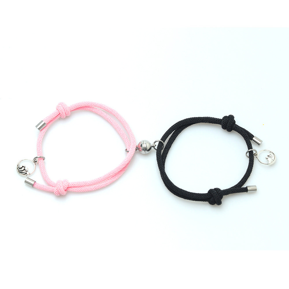 Two New Alloy Eachother Couple Bracelets, one pink and one black, on a white background